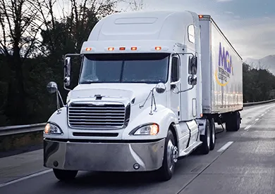White semi truck with enclosed trailer for full truckload shipping
